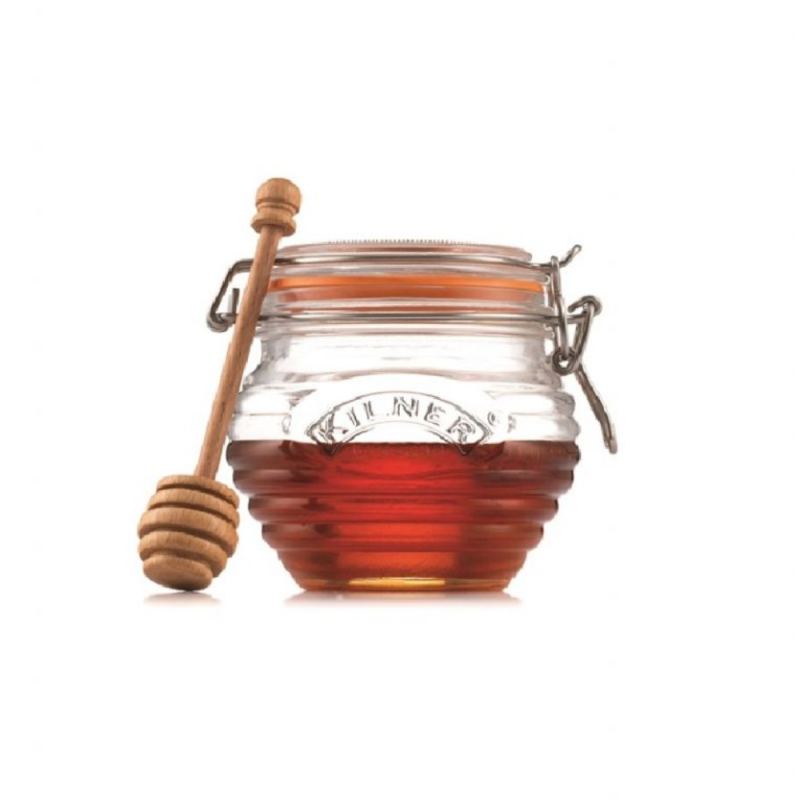 Tarro de miel con palo de madera